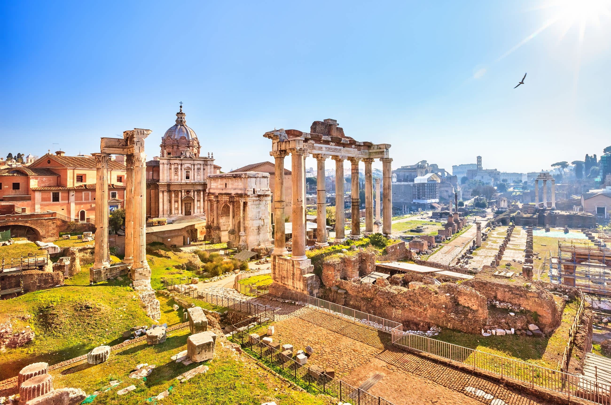 Roman Forum aerial view at dusk, crowds in Rome